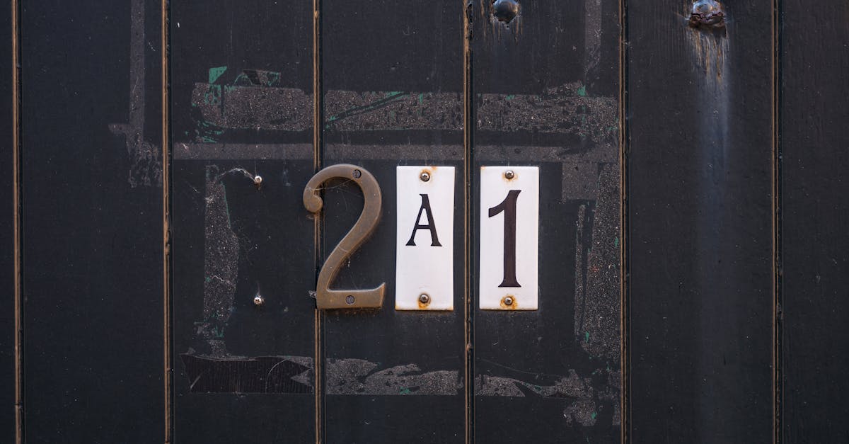 A dark numbered vault door, its engraved figures catching a low golden light