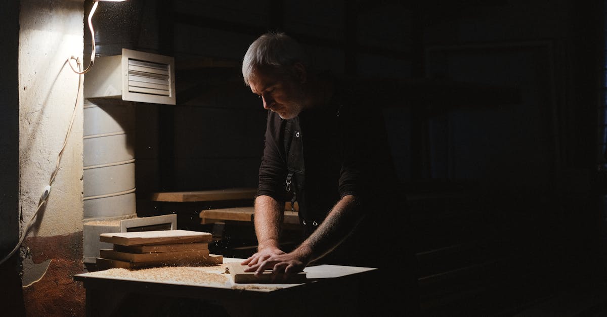 A dimly lit handcraft workshop with tools laid out, representing work that integrity refuses to mass-produce