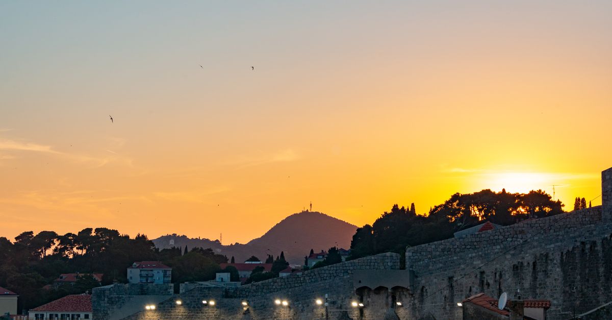 A fortress wall at dusk, representing something built to be defended without payment