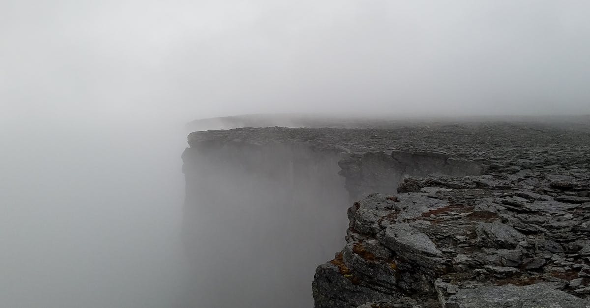 A stone rampart in fog, representing values that act as a moat no competitor can cross