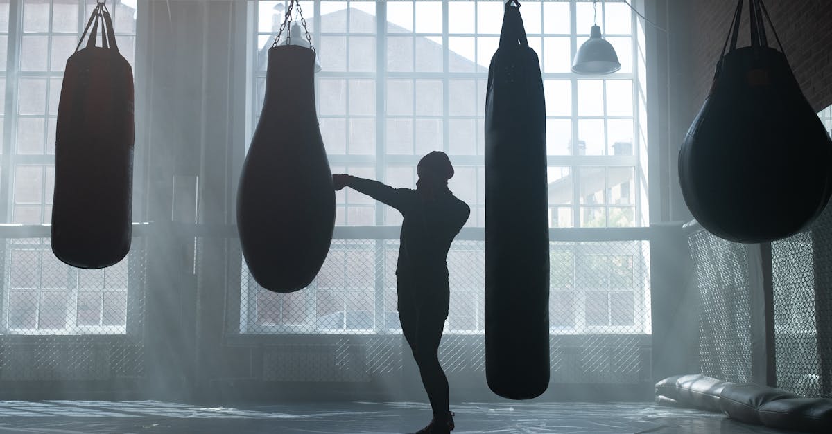 A solitary figure training in low light, the quiet repeated work that builds strength as a developed instrument
