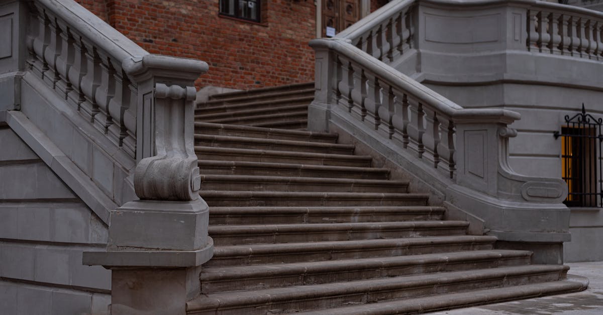 A flight of dark stone stairs ascending toward faint light at the top